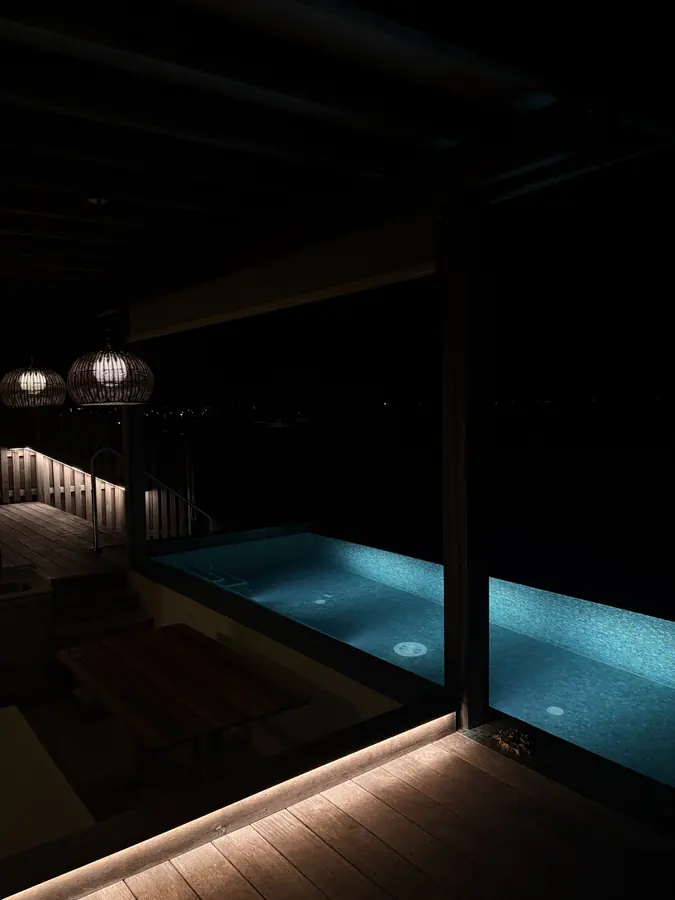 A lit pool at night