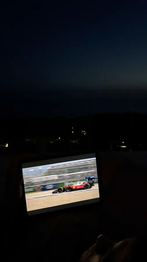 Watching a race on a tablet at night