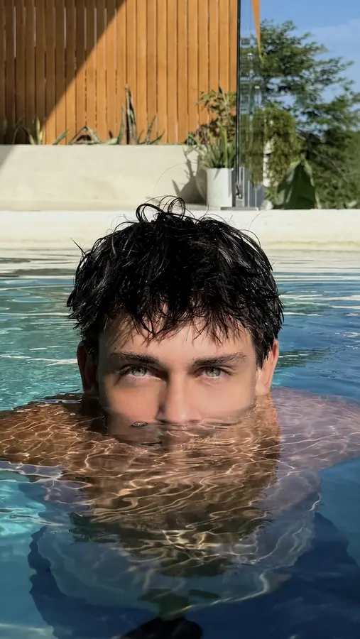 Brennan Harmatz surfacing, eyes just above the water
